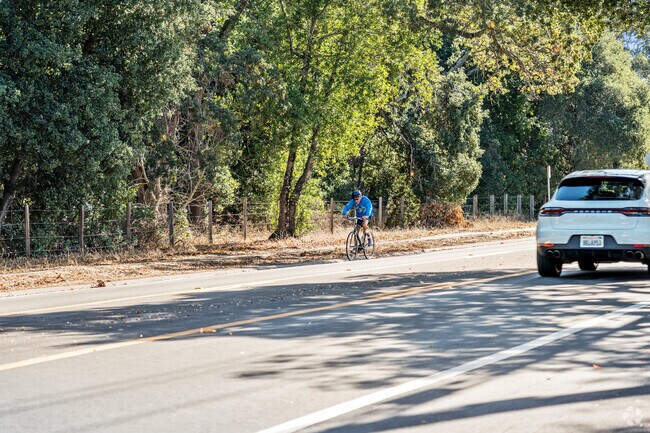 Cyclists and cars share the roads in Portola Valley.