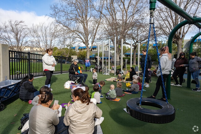 Robin Sweeny Park Playground hosts a book reading for children to enjoy.