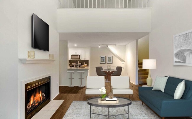 Renovated Package I kitchen, living, and dining areas with hard surface plank flooring