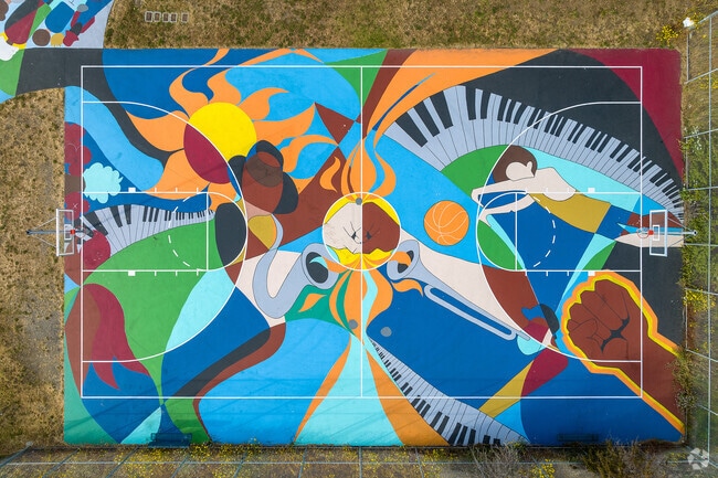 Colorful basketball court, a hub of recreation in Hunter's Point.