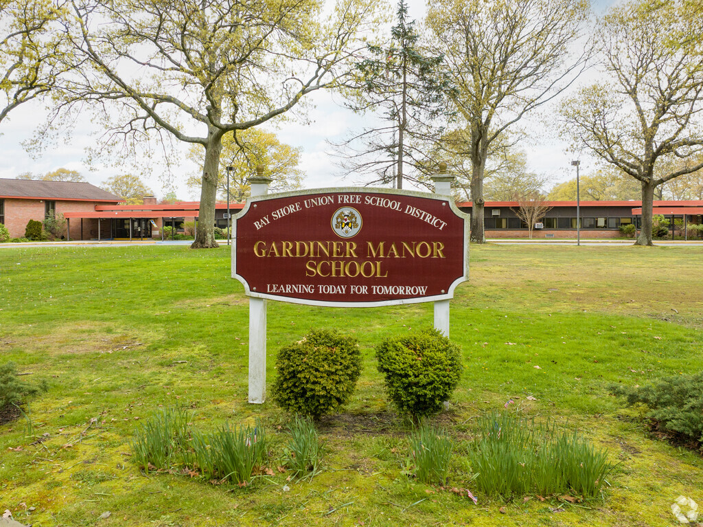 Signage at the entrance to Gardiner Manor School