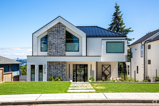 Geometric Shapes And White Coloring Make This A Show Stopping Home.
