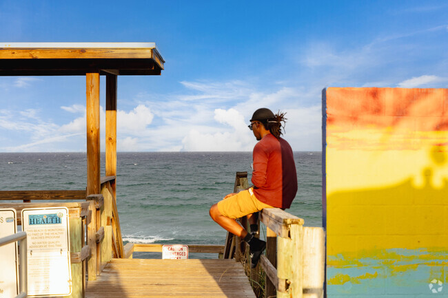 Ocean Breeze resident enjoying serene evening at the beach.