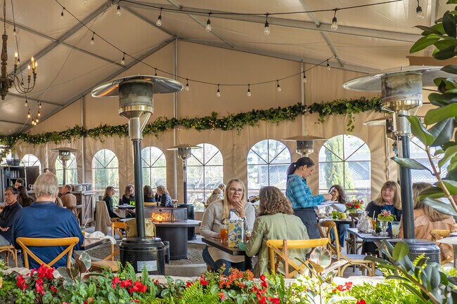 The Farmhouse at Rodgers Garden, a favorite among Broadmoor Sea View residents, offers farm-to-table dining in a charming setting, making it a popular spot for locals to enjoy delicious meals.