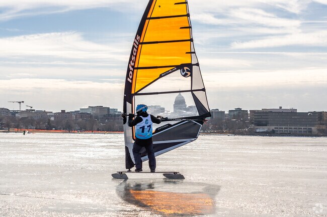 Watch in amazement as ice windsurfers glide on the lake at the Frozen Assets Festival.