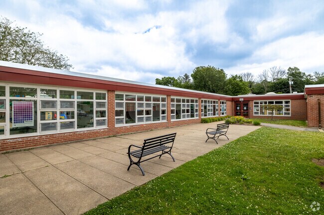 Students can take a seat in front of Spring Street Elementary School in West Bridgewater.