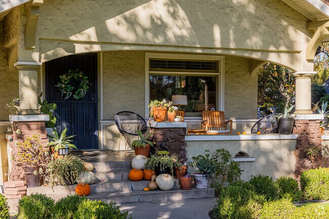 This home has season themed decorations displayed on its front proch.