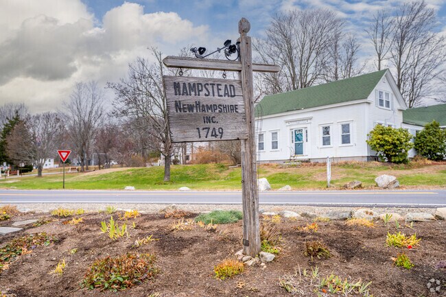 A wooden sign marks Hampstead’s founding in 1749, highlighting the town’s long history and rural charm.