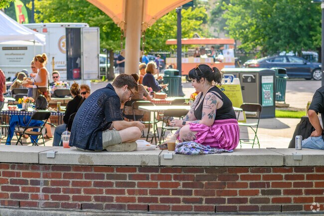 A couple enjoys Festival Friday's at Arcadia Festival Place, near South Westnedge.