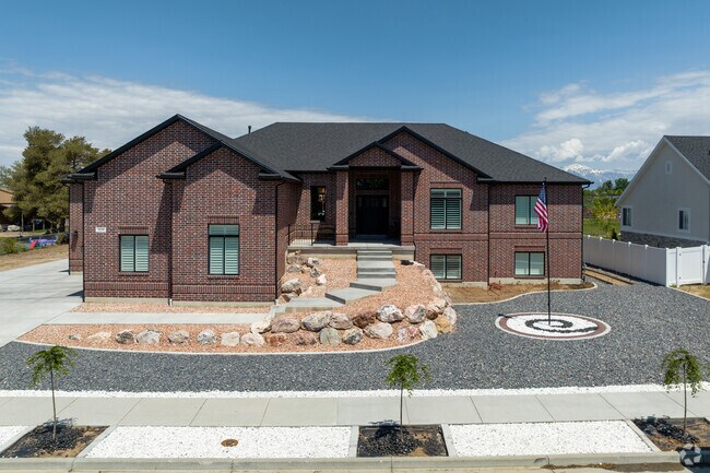 Beautiful brick home in West Point with a xeriscaped yard designed for easy care and curb appeal.