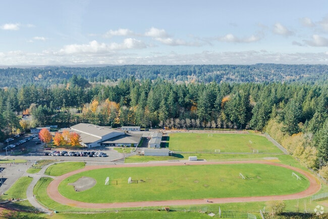 Profile shot of the school from an aerial perspective. Children at recess.