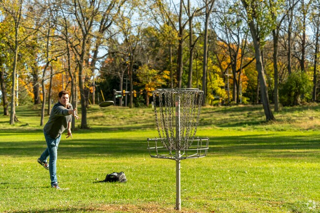 Creglow Heights locals play disc golf in one of Jackson's many parks.