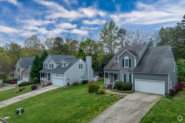 Deep River homes sit on large wooded lots with mature trees and serene surroundings.