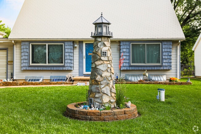 This home in Northwest Big River has a unique looking lighthouse statue in its front yard.