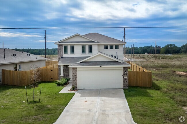 A two-story, Craftsman-style home with a manicured lawn and attached garage in Patton Village.