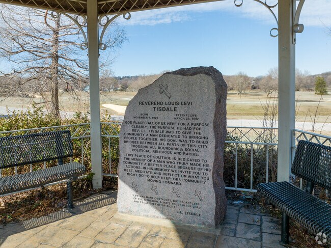 This placard is dedicated to L.L. Tisdale in the Gilcrease hills neighborhood.