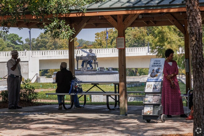 Local folks gather at the Ray Charles Park to listen to the continuous musical tribute.
