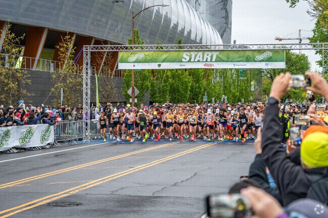 Runners in the Eugene Marathon begin the race in the South University neighborhood.