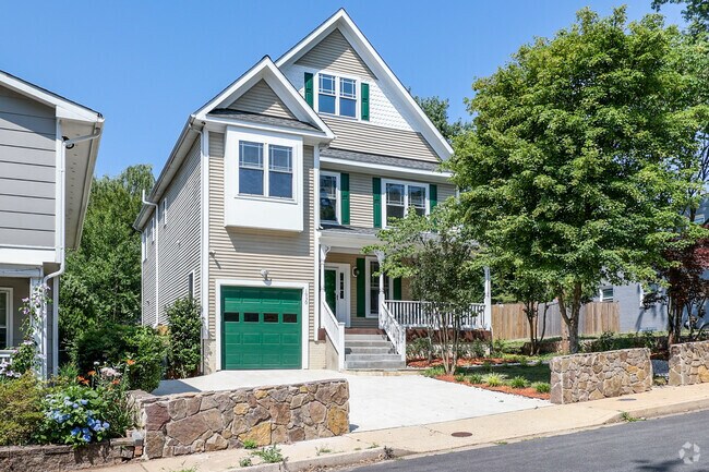 A charming Cape Cod house nestled near the scenic beauty of High View Park.