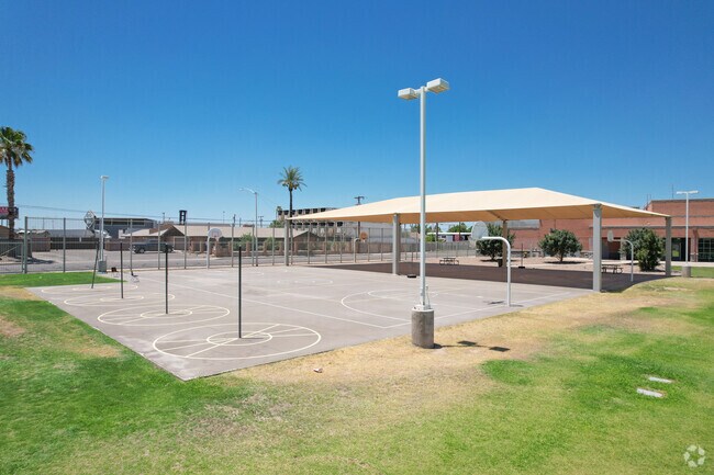 Students can play in a shaded basketball at Magnet Traditional School in central Phoenix.