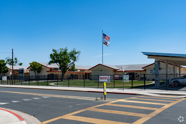The entrance to Del Vista Math and Science Academy is directly across form the cross walk.