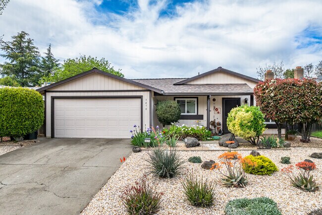 This traditional ranch-style home has a water friendly beautiful landscaping in Countryside.