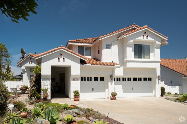 This Mediteranean style homes has manicured cactus garden in Ocean Hills.