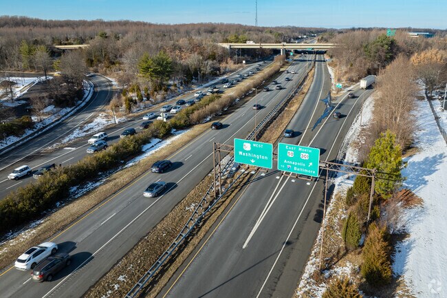 Route 50 a few miles north of Tall Oaks Crossing is the closes highways to get around.