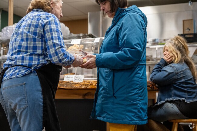 A customer has her order hand delivered at Corner Cafe located just outside of Warwick.