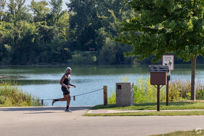 A jogger runs along a trail by Baumann Lake in Cherry Valley.