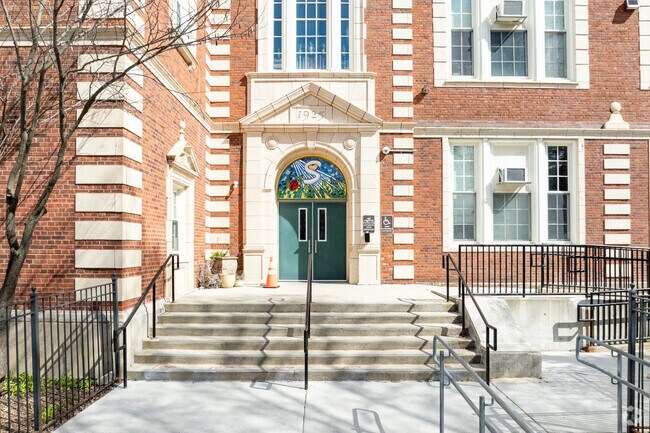 Sutherland Elementary School brick facade and student entrance.