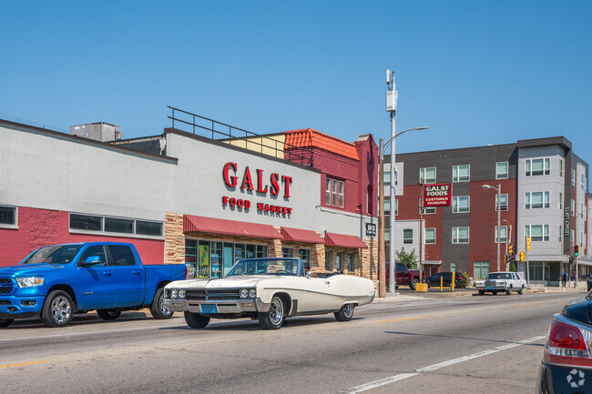 A vintage convertible drives along North Ave past the Galst Food Market in Triangle North, WI.