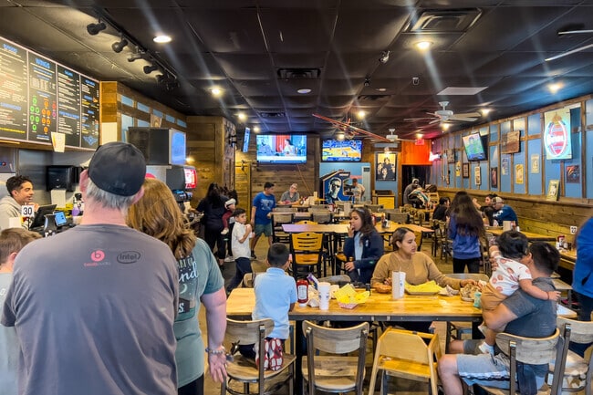 Families gather at Wings Over Seagoville for casual dining.