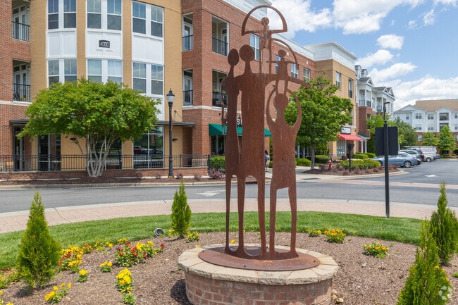 This metal statute at Grace Park in Morrisville represents family.