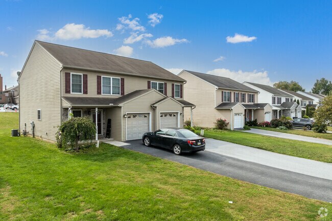 Twin homes with attached garages are common in the suburbs of New Holland.