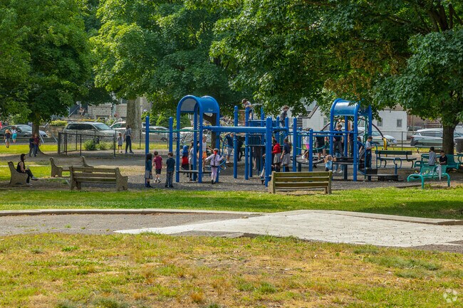 Kids can enjoy Marconi Plaza at the jungle gym and swing set.