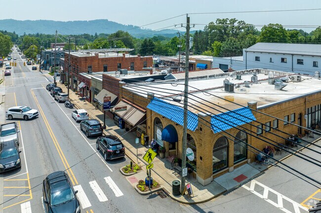 Locals amble along Main Street to browse the shops and eateries inhabiting the old brick facades