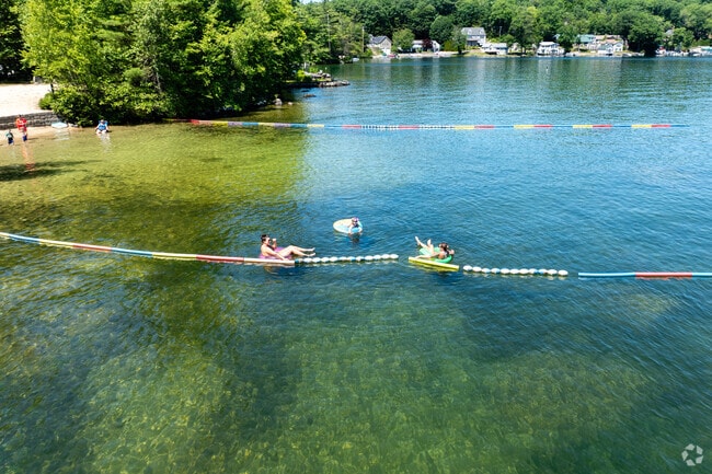 Residents and visitors alike enjoy the crystal-clear waters of Merrymeeting Lake in New Durham.