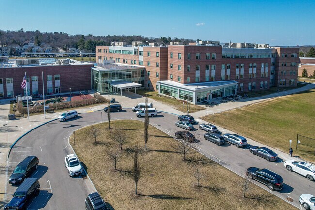 Newton High School entrance has a drop-off area.