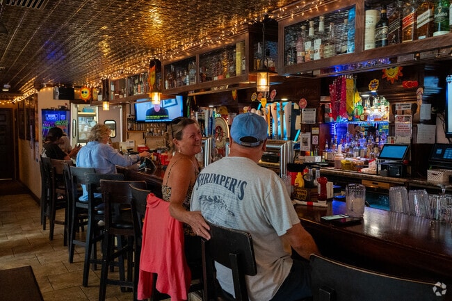 Grab a drink at Herner's Hideaway, which hosts live music and sand volleyball games.