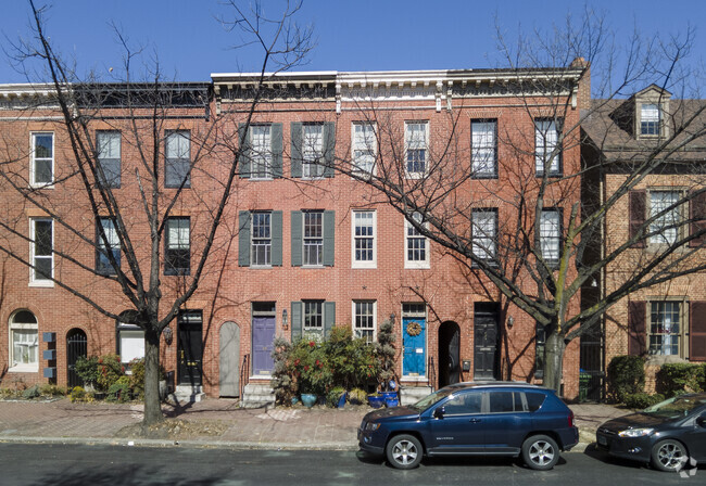 Colored front doors contrast with the classic red brick row homes in Otterbein.