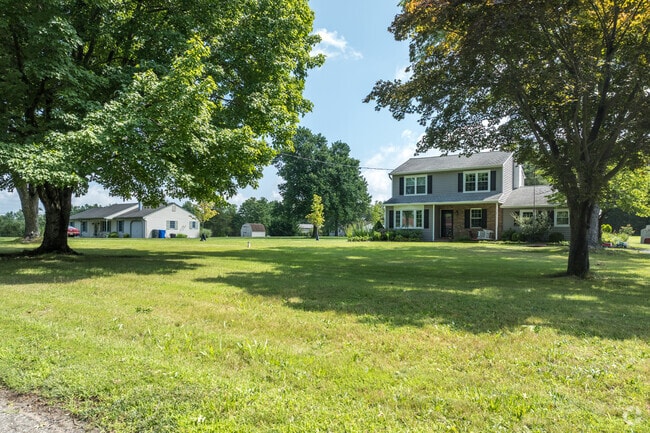 Homes are situated on sizable front yards.