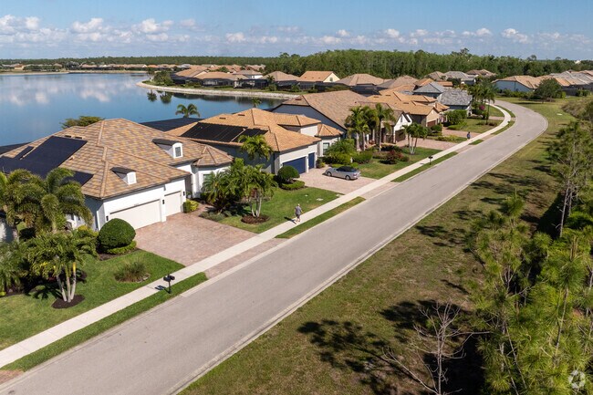 The homes of Corkscrew Shores wind their way around the shorelines of a beautiful lake.