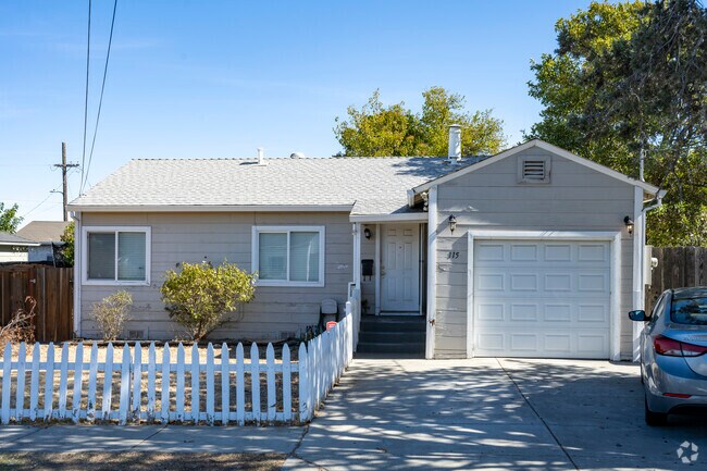 Compact homes with picket fences are common in Bay Point West.
