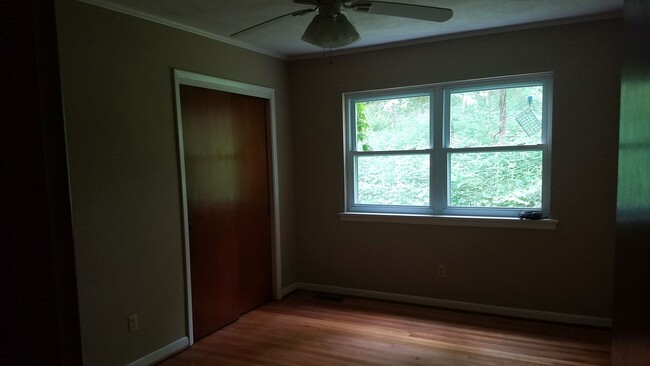 Each bedroom has two windows, large wall closets, and ceiling fans.