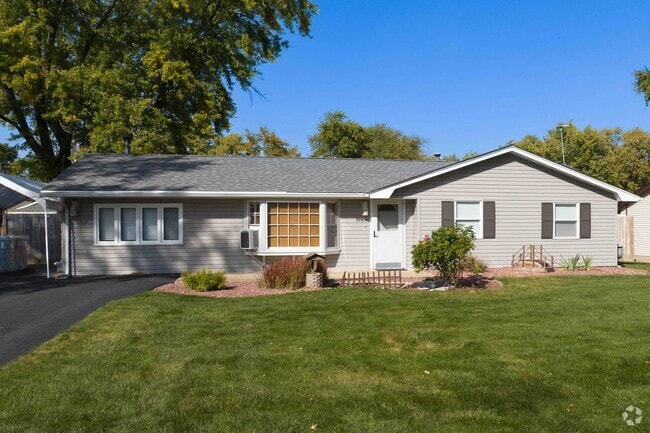 Many homes have beautiful manicured lawns in the Lewis University area.