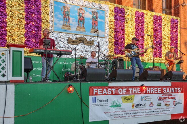 Bands play to crowds at the Feast of Three Saints.