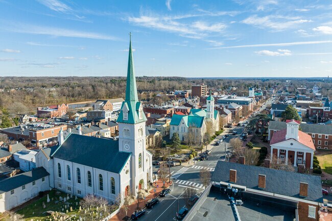 Old churches stick out amongst other buildings in downtown Fredericksburg.
