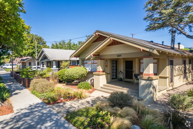 A row of homes with elaborate landscaping in Bluff Heights.