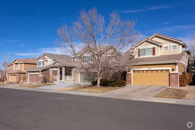 Row of houses with two story garages in Foxfield.